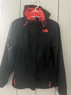 The North Face Women’s Black Raincoat with Neon Orange Accents